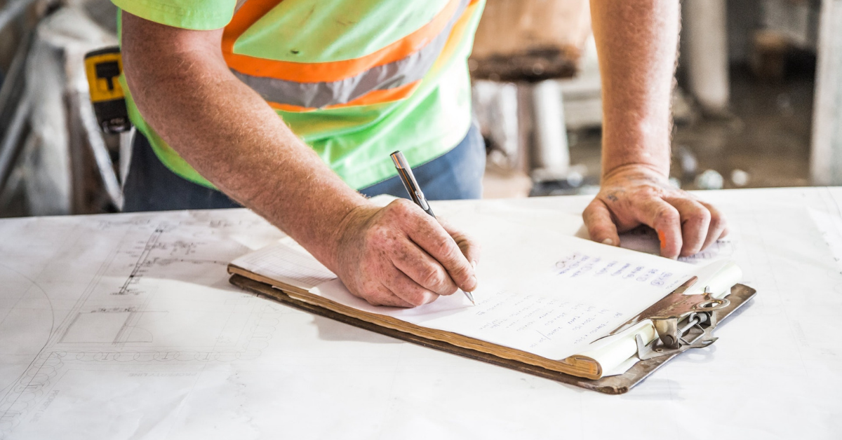 Laborer drafting schematics